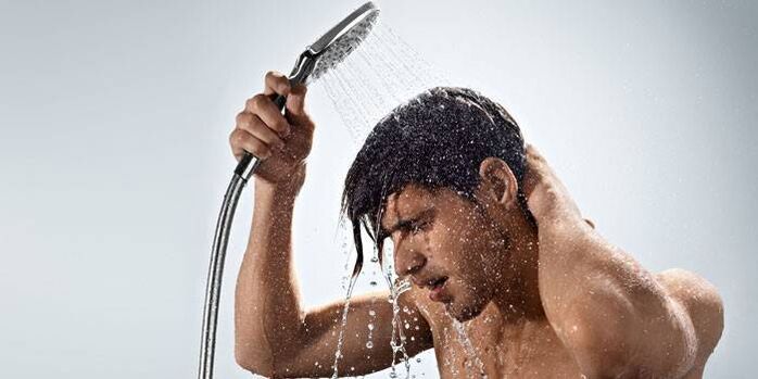 A man takes a contrast shower to increase blood flow and increase potency.